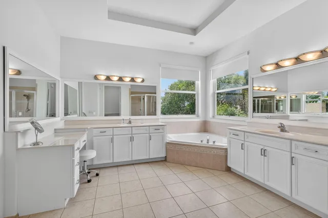 an aerial view of a house with swimming pool garden and patio