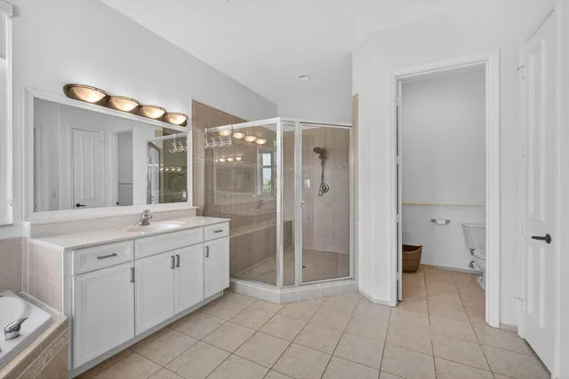 an aerial view of a swimming pool with a yard