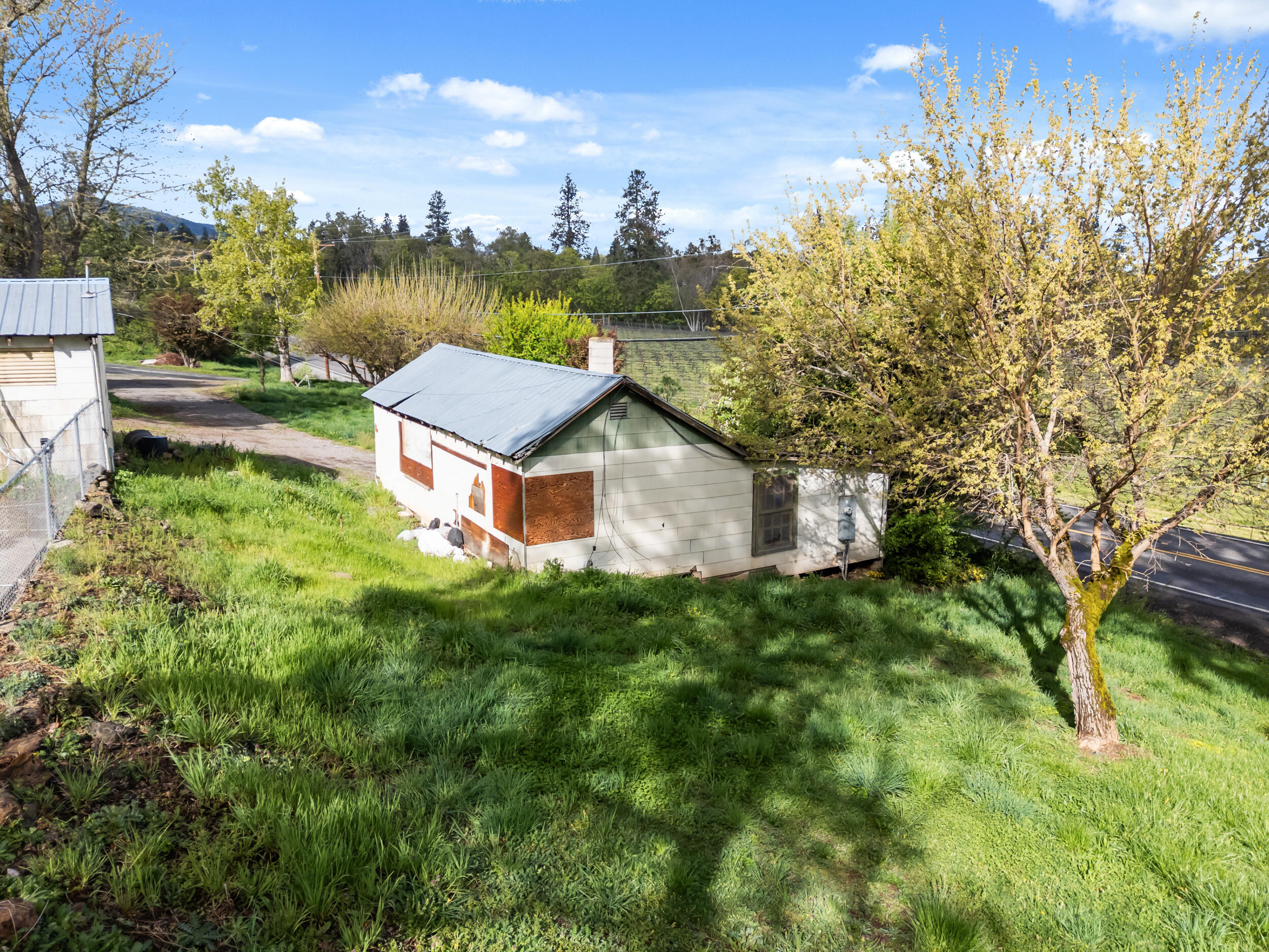 2373 Pioneer Road Talent, OR 97540 - Photo 24 of 28 a view of a house with a yard and sitting area