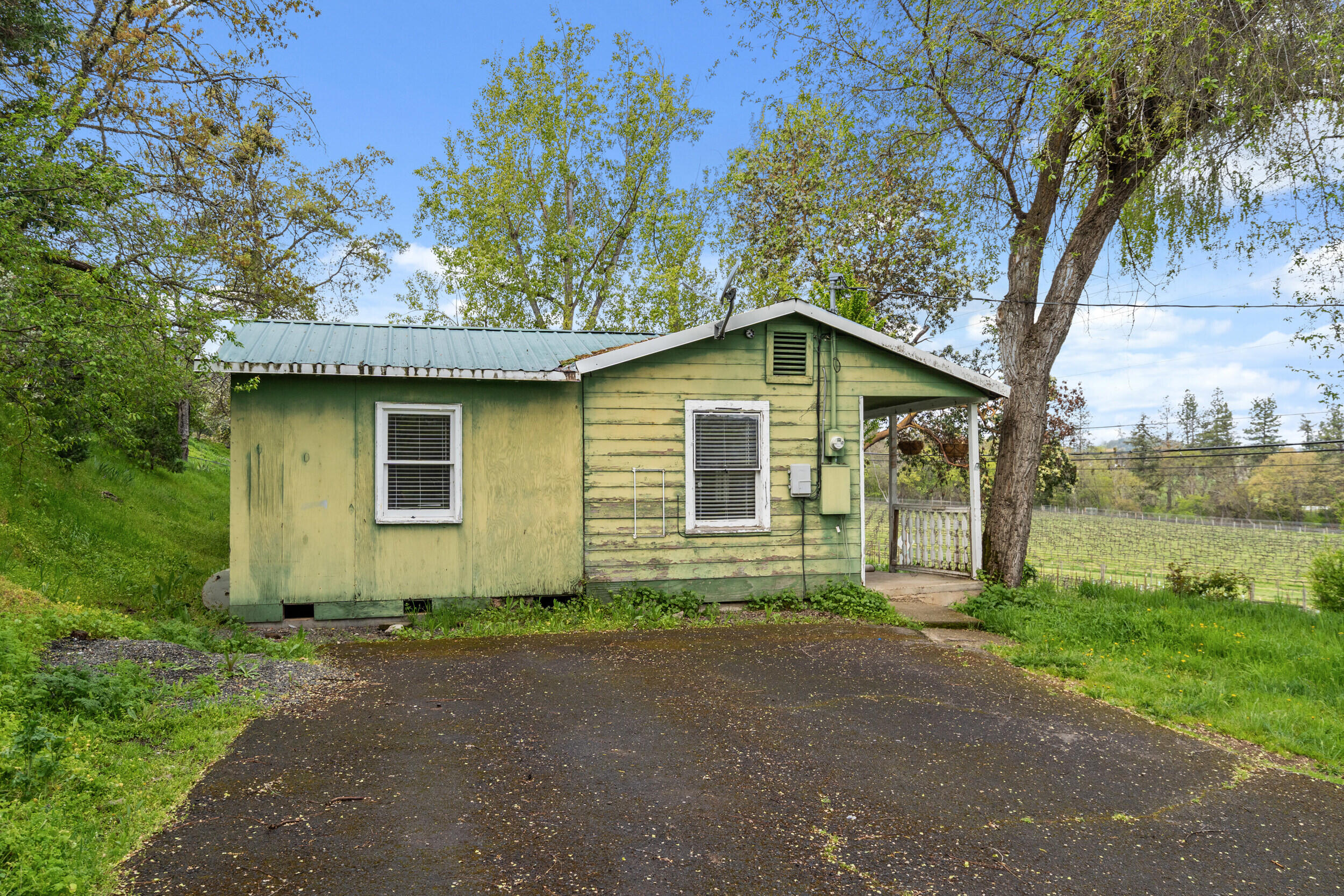 2373 Pioneer Road Talent, OR 97540 - Photo 9 of 28 a front view of a house with garden