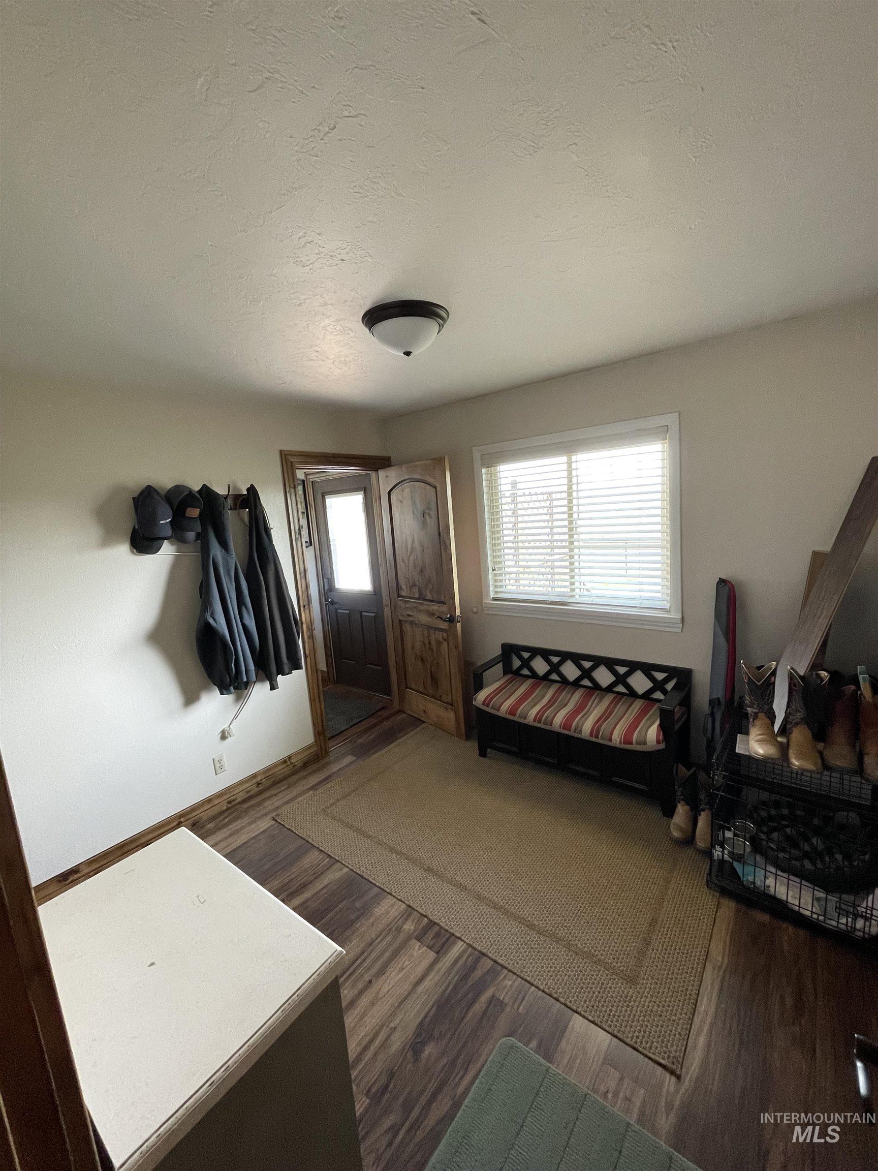 2155 East 1775 South Gooding, ID 83330 - Photo 8 of 18 Entryway featuring a textured ceiling and dark wood-style floors