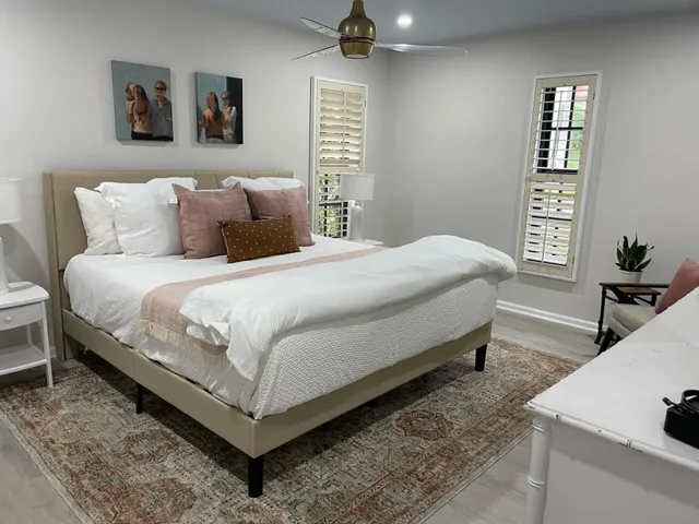 a bedroom with a bed and a table in it