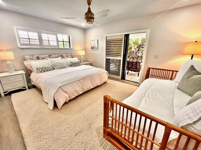 a bedroom with bed and a window