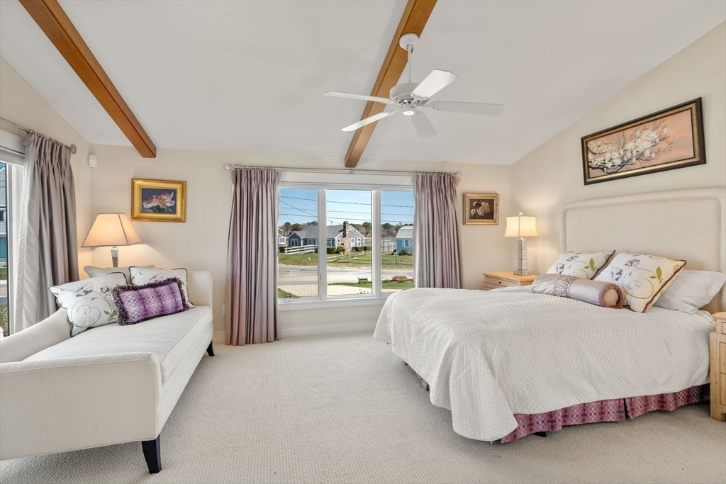 1 Beach View Road West Dennis, MA 02670 - Photo 12 of 20 a spacious bedroom with a bed and a large window