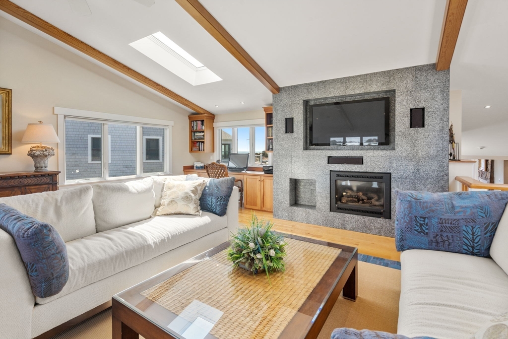 1 Beach View Road West Dennis, MA 02670 - Photo 3 of 20 a living room with fireplace furniture and a flat screen tv