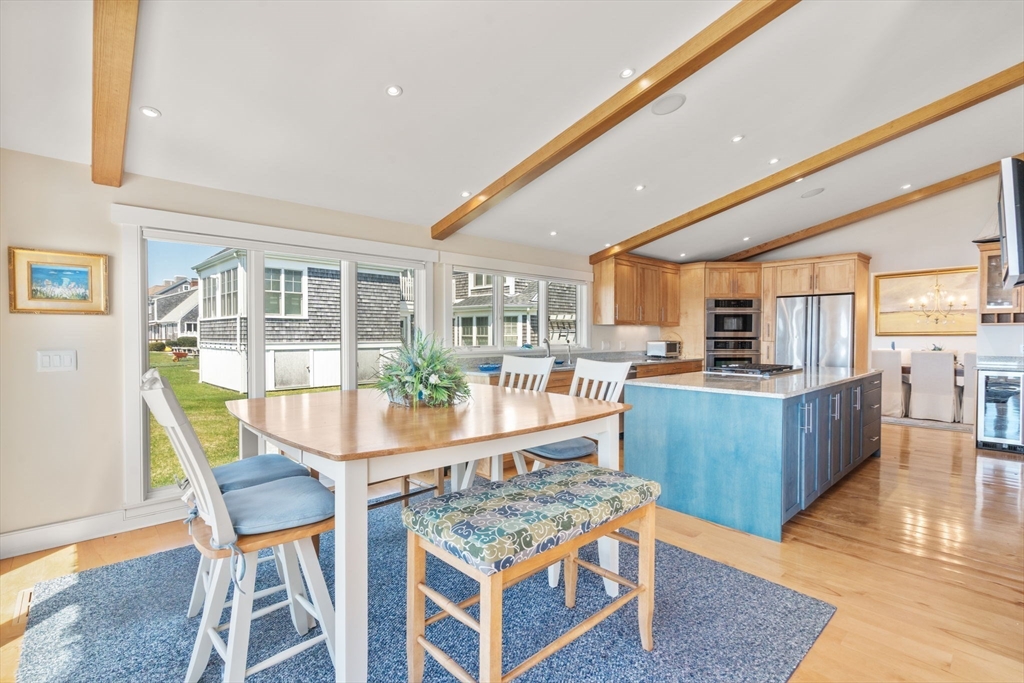 1 Beach View Road West Dennis, MA 02670 - Photo 6 of 20 a view of a dining room with furniture wooden floor and kitchen view