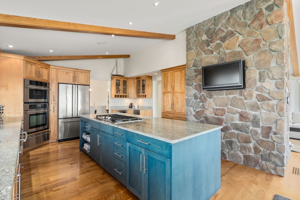 1 Beach View Road West Dennis, MA 02670 - Photo 7 of 20 a kitchen with stainless steel appliances a stove a sink and a refrigerator