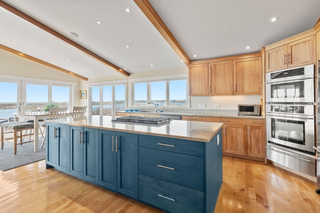 1 Beach View Road West Dennis, MA 02670 - Photo 8 of 20 a kitchen with stainless steel appliances granite countertop a stove sink and cabinets