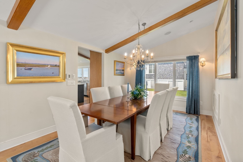 1 Beach View Road West Dennis, MA 02670 - Photo 9 of 20 a view of a dining room with furniture and wooden floor