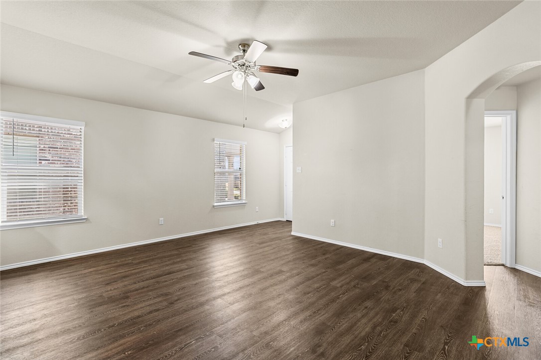 256 Bainbridge Road Temple, TX 76502 - Photo 11 of 40 a view of an empty room with wooden floor and a window