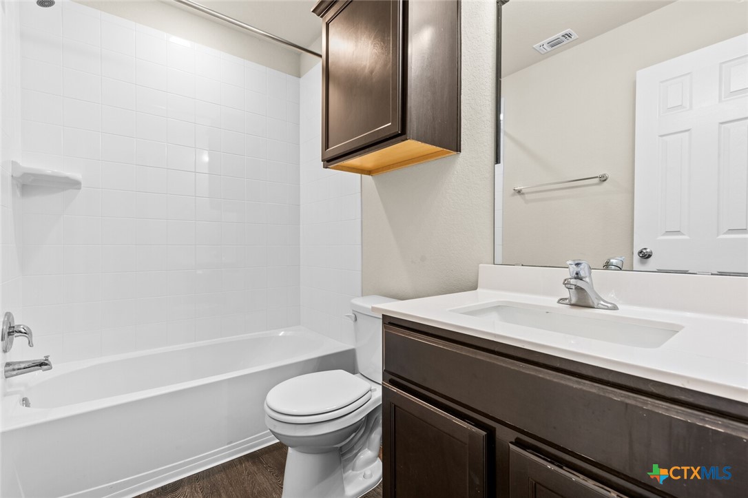 256 Bainbridge Road Temple, TX 76502 - Photo 22 of 40 a bathroom with a sink a toilet and shower
