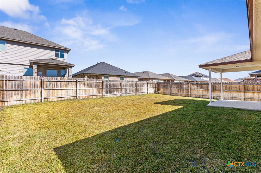 256 Bainbridge Road Temple, TX 76502 - Photo 33 of 40 a view of a large house with a swimming pool and a yard