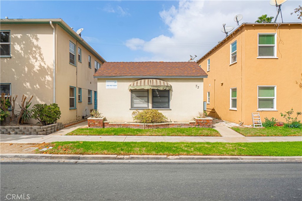 75 Granada Avenue Long Beach, CA 90803 - Photo 3 of 12 a view of a house with a backyard and a yard