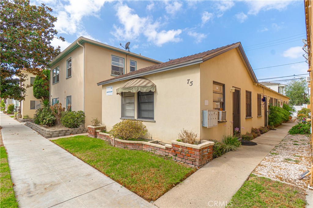 75 Granada Avenue Long Beach, CA 90803 - Photo 4 of 12 a front view of a house with a yard