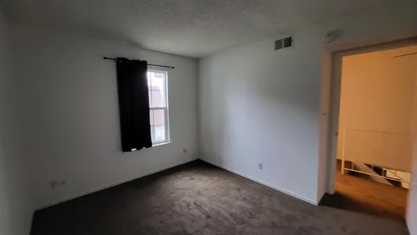 an empty room with windows