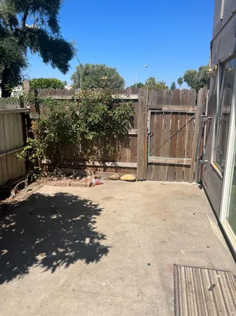 a view of roof deck with a yard