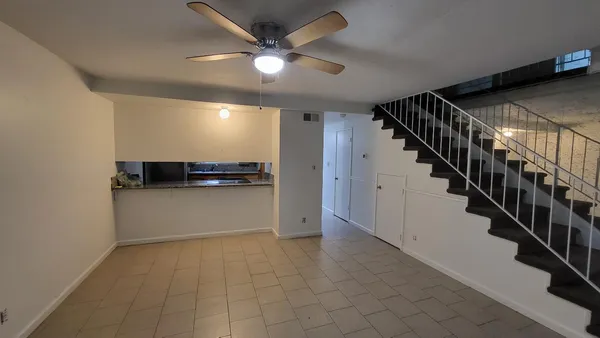 a view of an empty room with stairs