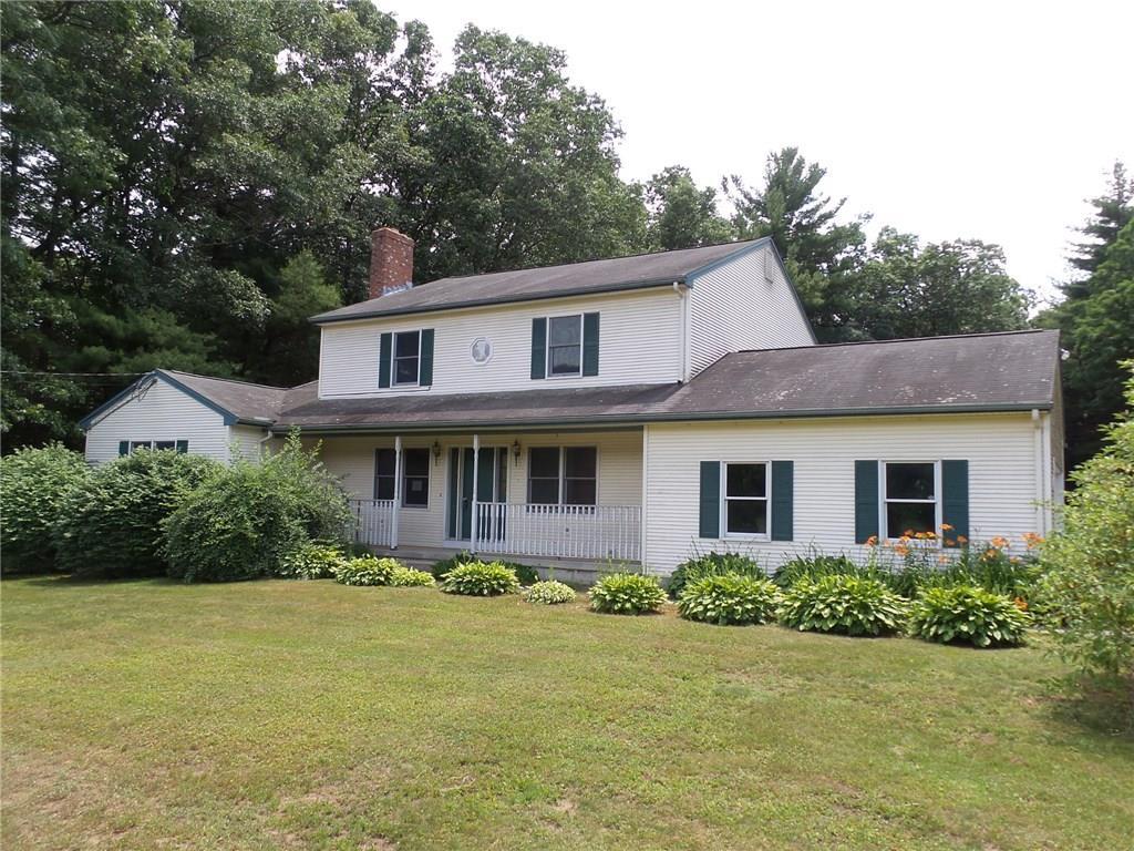 864 Stone Road Windsor, CT 06095 - Photo 1 of 1 a front view of a house with garden