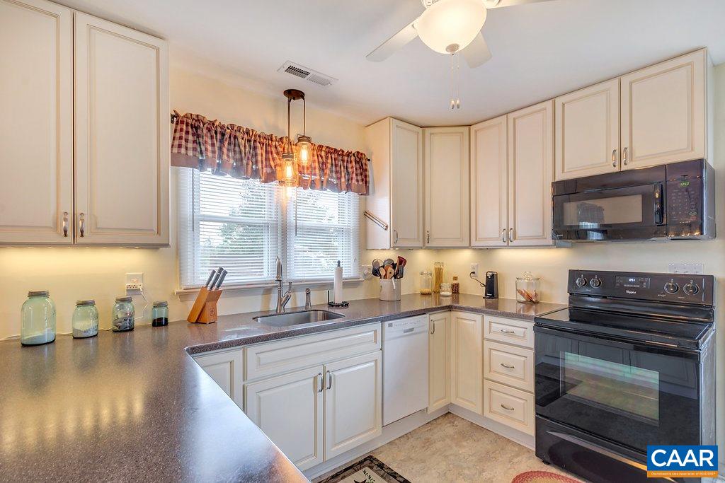 353 Locust Lane Ruckersville, VA 22968 - Photo 7 of 22 a kitchen with a sink stove and microwave