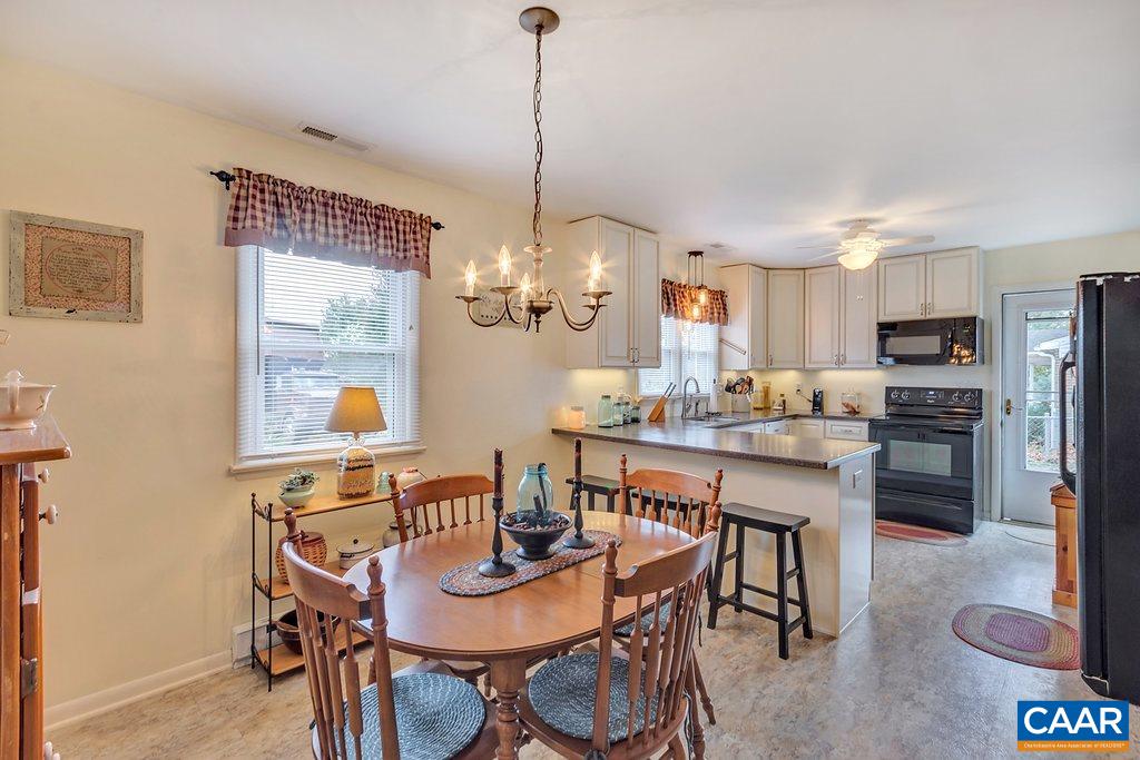 353 Locust Lane Ruckersville, VA 22968 - Photo 8 of 22 a view of a dining room with furniture