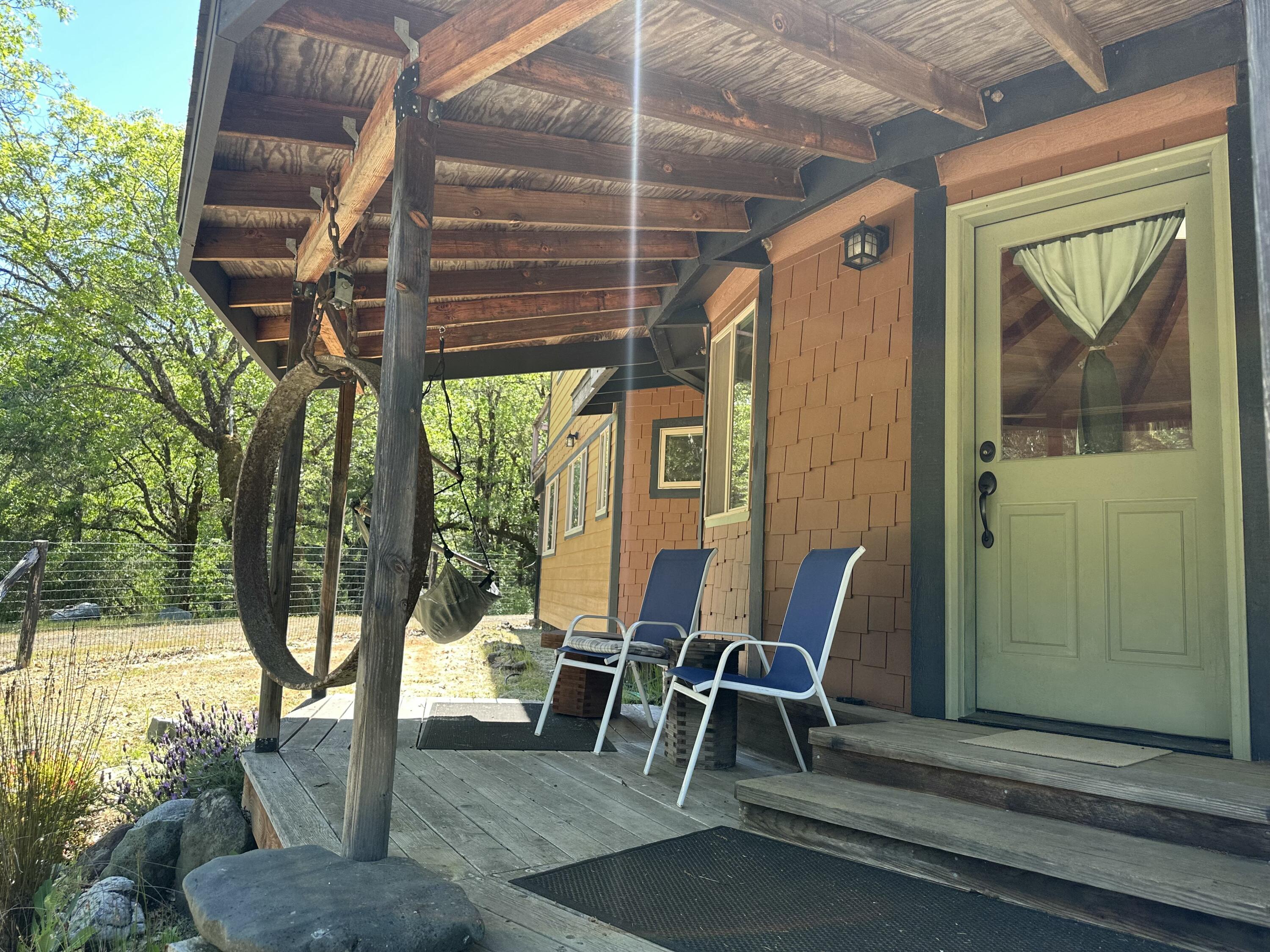 83000 Milstead Road Garberville, CA 95542 - Photo 30 of 67 a view of porch with a table and chairs