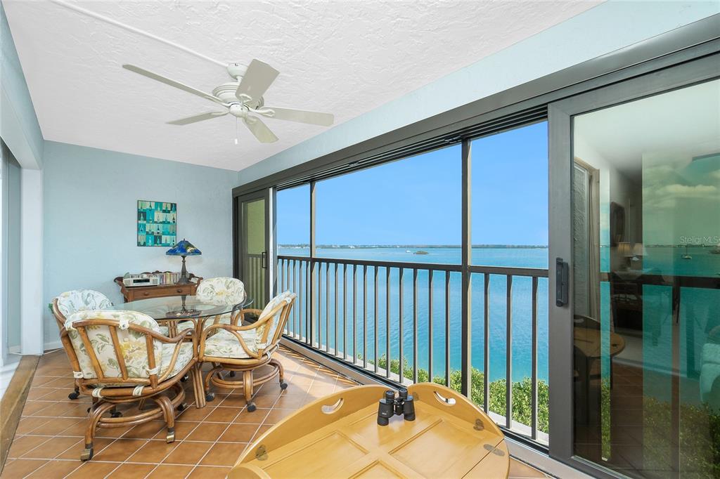 1651 Beach Road, Unit 301 Englewood, FL 34223 - Photo 11 of 68 a dining room with furniture window and ceiling fan
