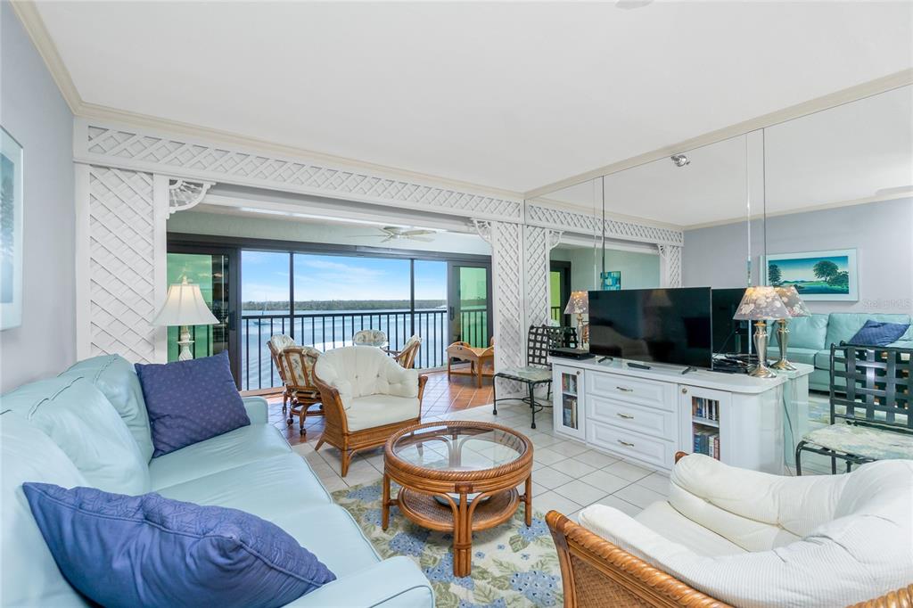 1651 Beach Road, Unit 301 Englewood, FL 34223 - Photo 12 of 68 a living room with furniture and a flat screen tv