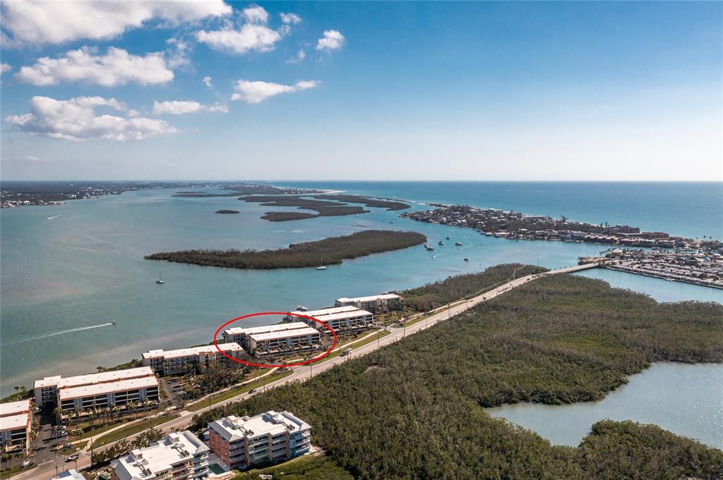 1651 Beach Road, Unit 301 Englewood, FL 34223 - Photo 2 of 68 a view of a lake with a city