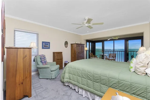 a spacious bedroom with two beds and a chandelier