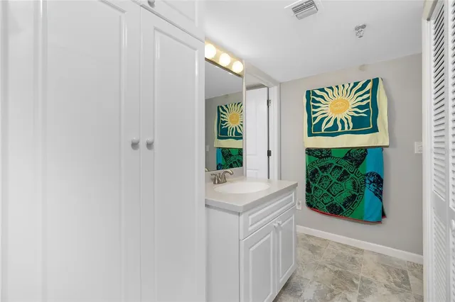 a view of swimming pool with lawn chairs and a fire pit