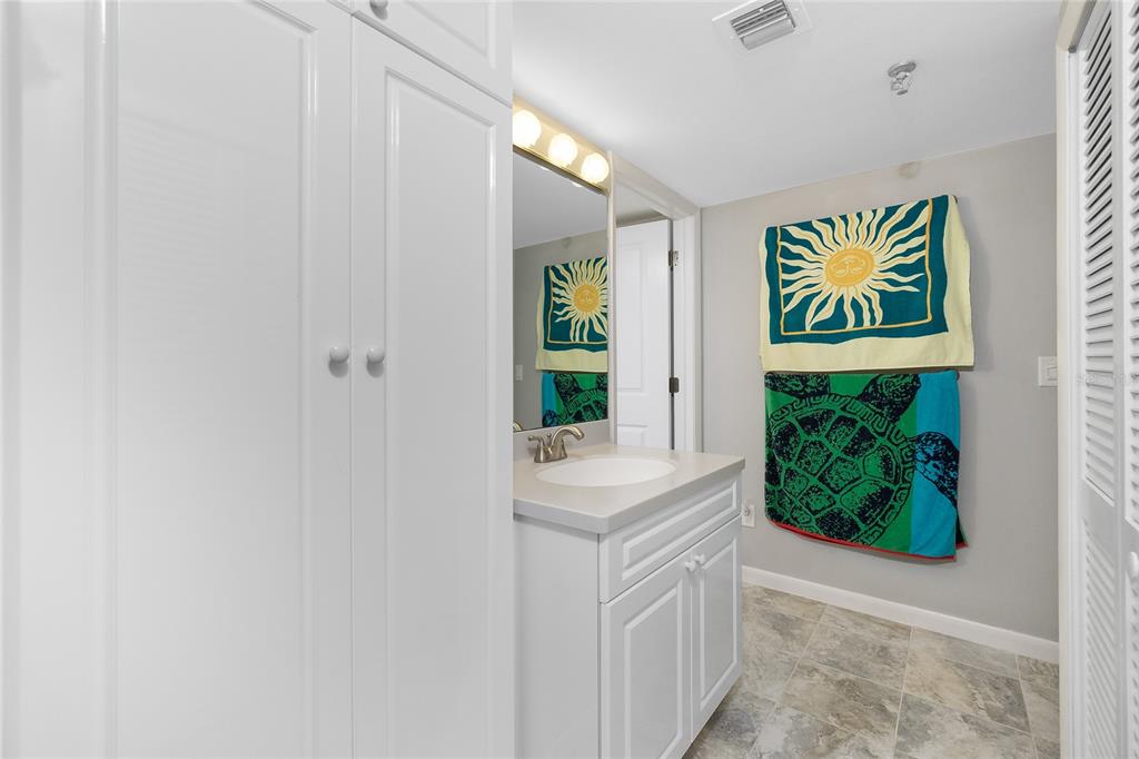 1651 Beach Road, Unit 301 Englewood, FL 34223 - Photo 33 of 68 a bathroom with a window and a shower