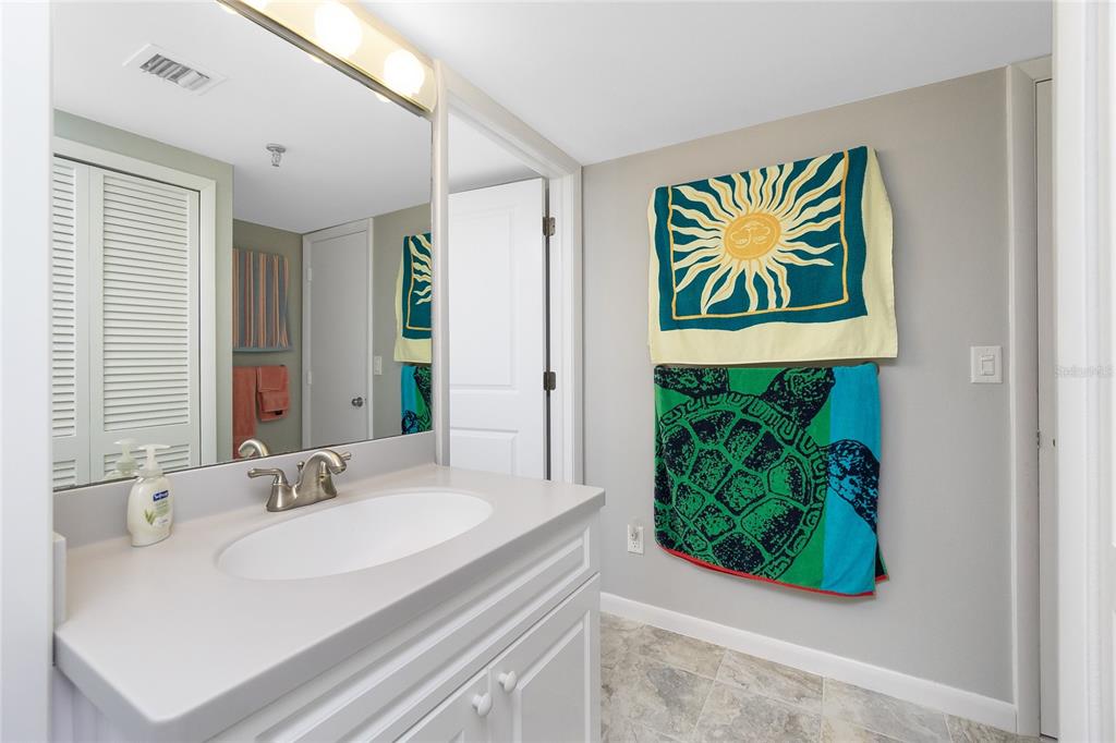1651 Beach Road, Unit 301 Englewood, FL 34223 - Photo 34 of 68 a bathroom with a sink and a mirror