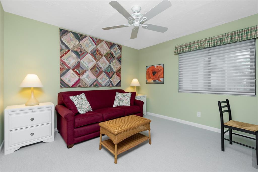 1651 Beach Road, Unit 301 Englewood, FL 34223 - Photo 39 of 68 a living room with furniture and a window