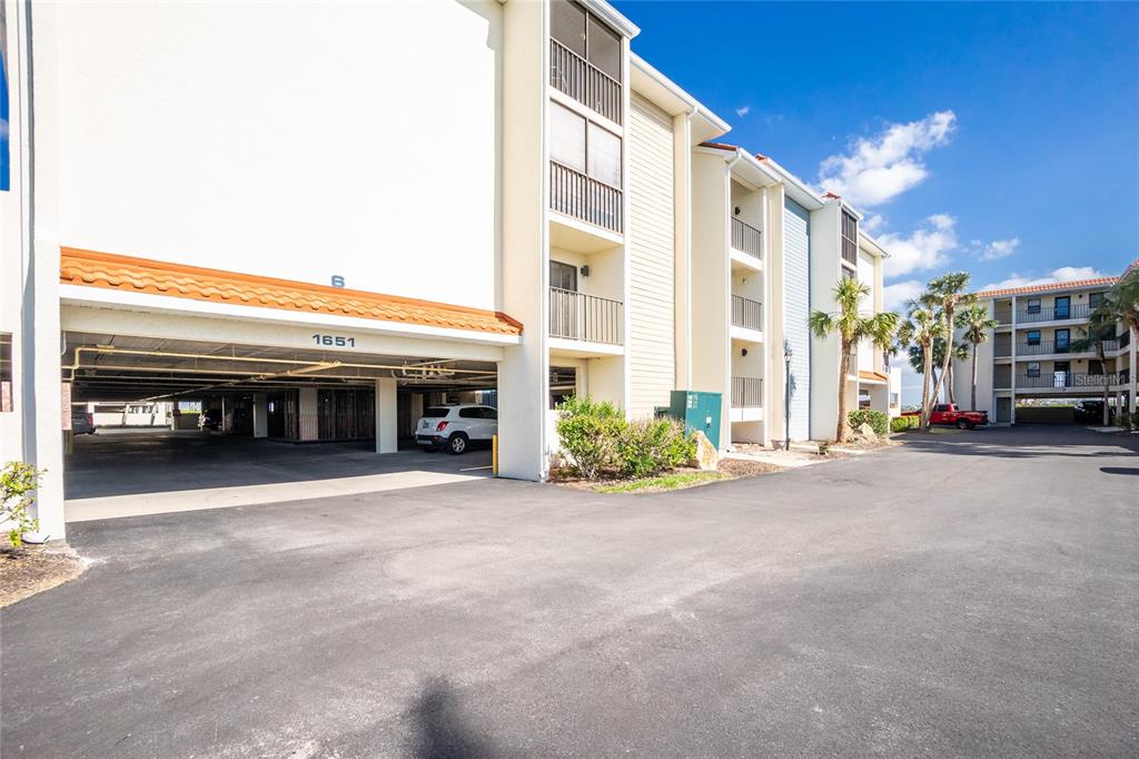 1651 Beach Road, Unit 301 Englewood, FL 34223 - Photo 42 of 68 a view of a building with a street