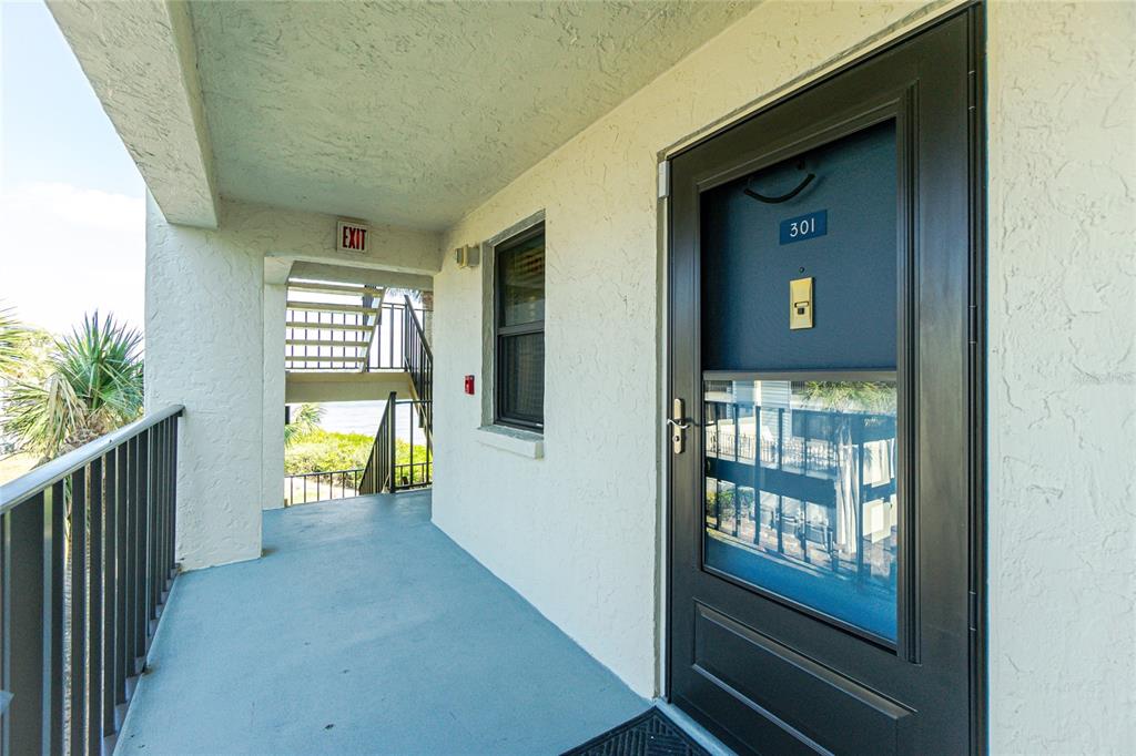 1651 Beach Road, Unit 301 Englewood, FL 34223 - Photo 6 of 68 a view of an entryway with wooden floor