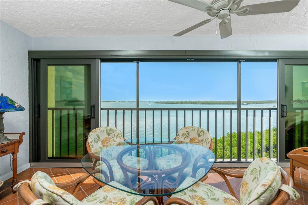 1651 Beach Road, Unit 301 Englewood, FL 34223 - Photo 8 of 68 a dining room with furniture and a window