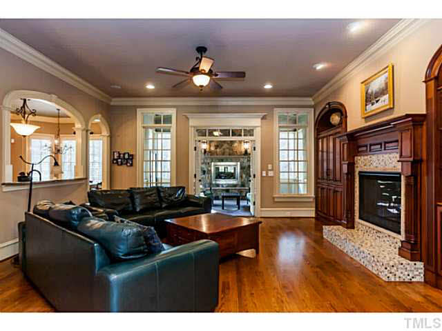 2429 Trenton Woods Way Raleigh, NC 27607 - Photo 6 of 25 Welcoming family room with custom built-ins . Easy flow onto the cozy screened porch!