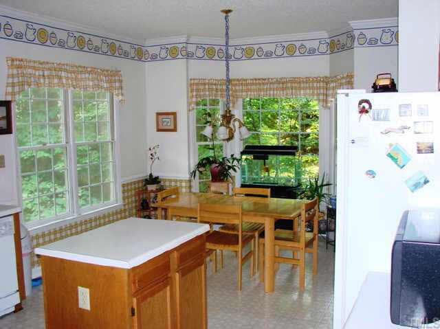 202 Kingsmill Road Cary, NC 27511 - Photo 4 of 8 a view of a dining room with furniture window and outside view