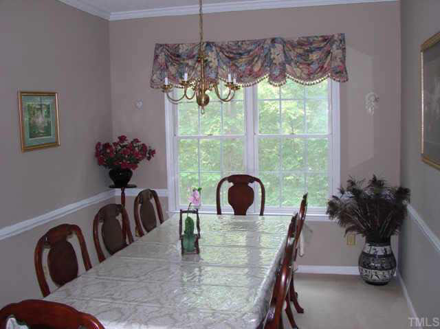 202 Kingsmill Road Cary, NC 27511 - Photo 6 of 8 a view of a dining room with furniture window and outside view