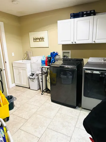 a kitchen with a stove a sink and a refrigerator
