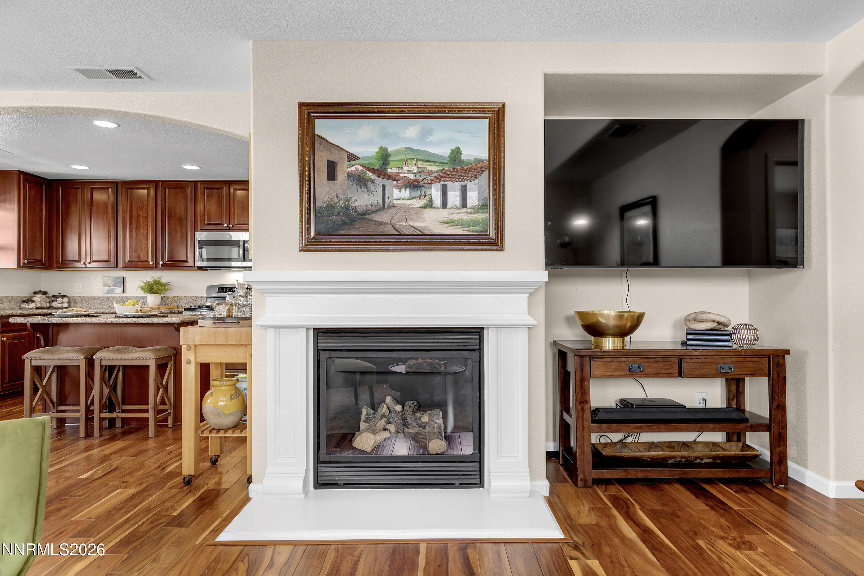 1642 Spring Hill Drive Reno, NV 89523 - Photo 13 of 43 a living room with furniture a fireplace and kitchen view