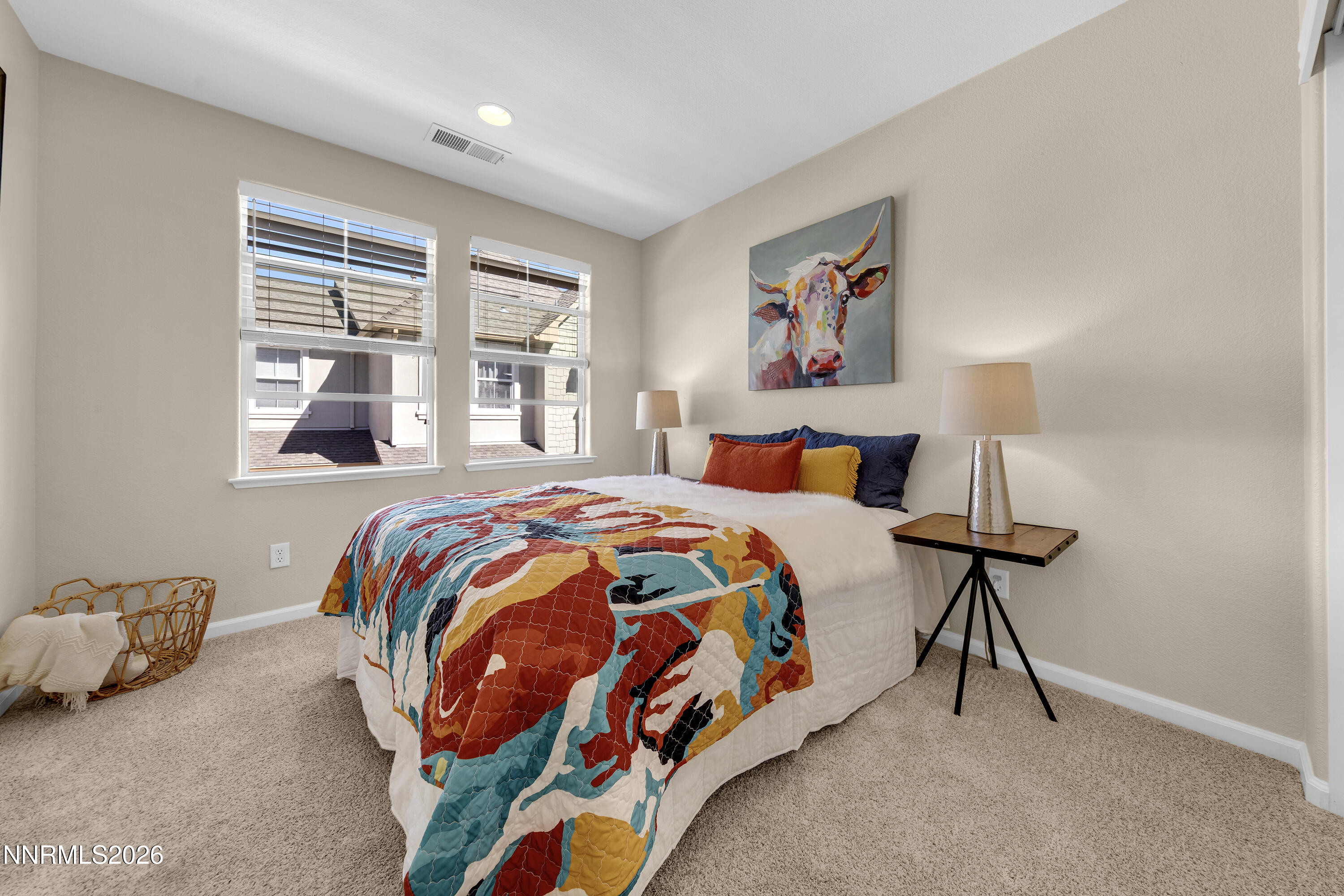 1642 Spring Hill Drive Reno, NV 89523 - Photo 22 of 43 a bedroom with a bed and a lamp next to a window