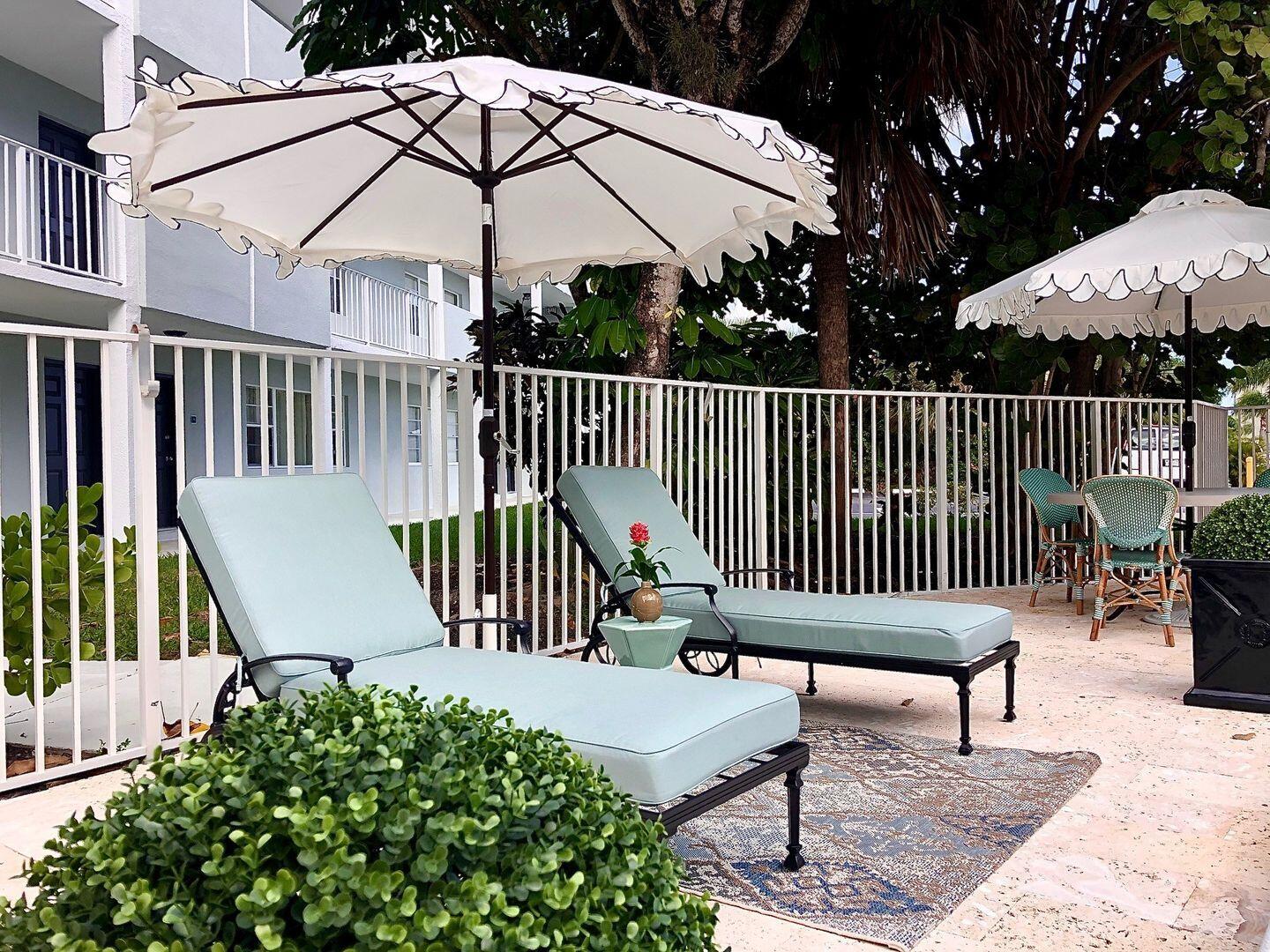 2711 Vandiver Drive, Unit 307 West Palm Beach, FL 33409 - Photo 12 of 15 a view of a roof deck with furniture