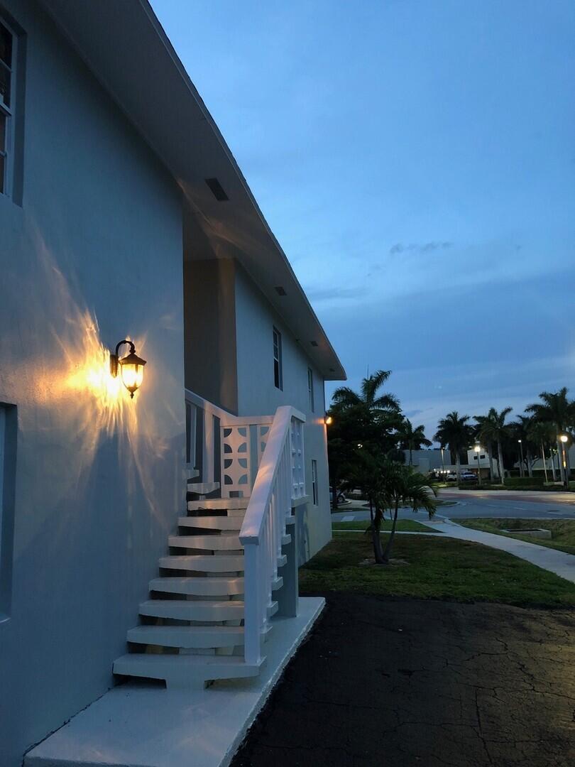 2711 Vandiver Drive, Unit 307 West Palm Beach, FL 33409 - Photo 15 of 15 a view of a yard in front of a house