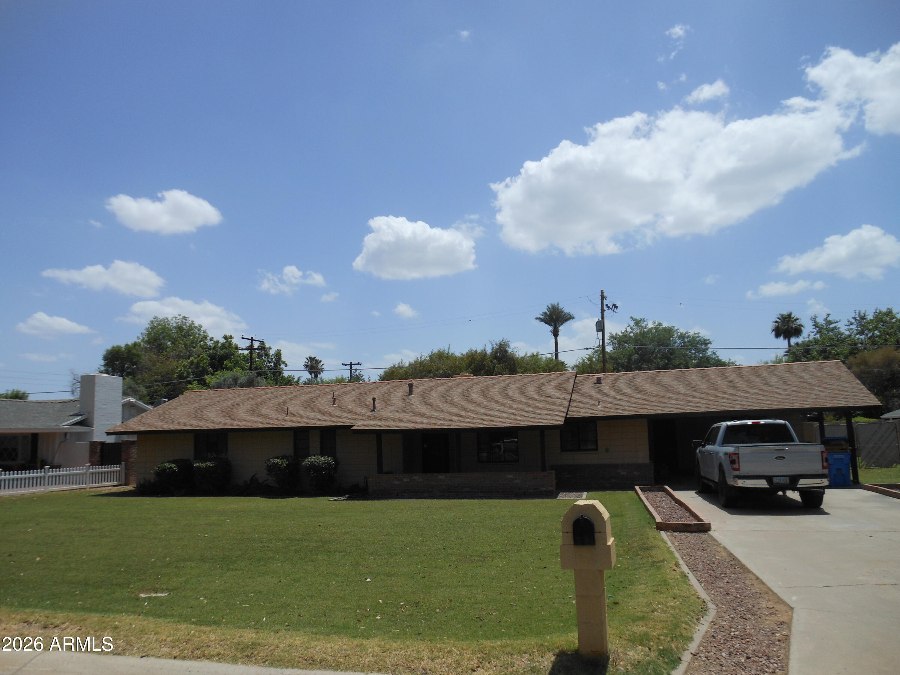 319 West Royal Palm Road Phoenix, AZ 85021 - Photo 2 of 2 a front view of a house with a garden and yard