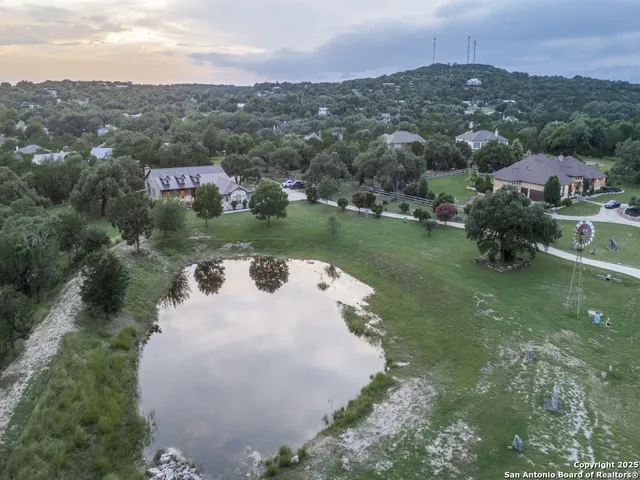 an aerial view of a house with yard