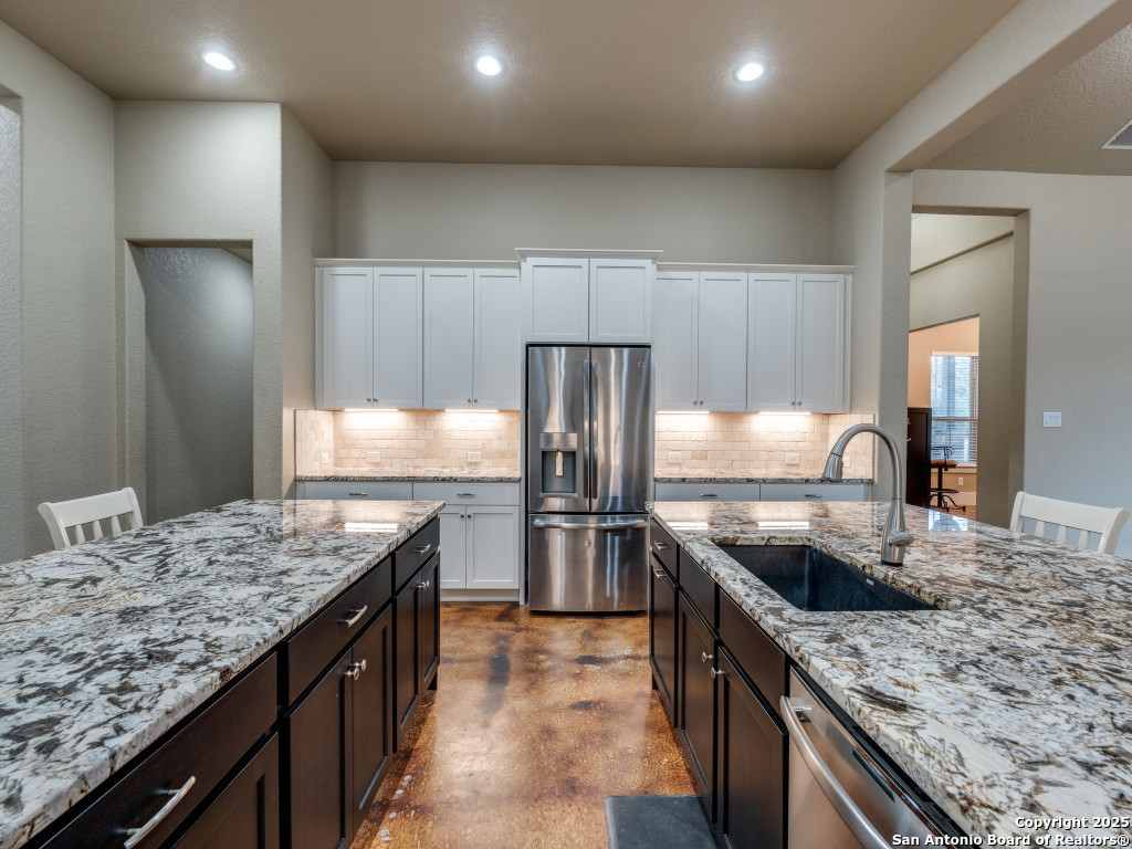 629 Windmill Ranch Road Spring Branch, TX 78070 - Photo 12 of 34 a kitchen with a stove sink and refrigerator
