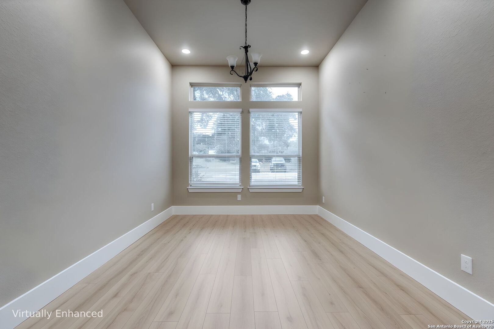 629 Windmill Ranch Road Spring Branch, TX 78070 - Photo 15 of 34 a view of an empty room with wooden floor and a window