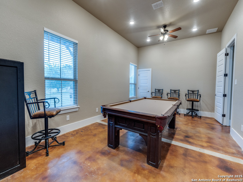 629 Windmill Ranch Road Spring Branch, TX 78070 - Photo 23 of 34 a room with furniture pool table and windows