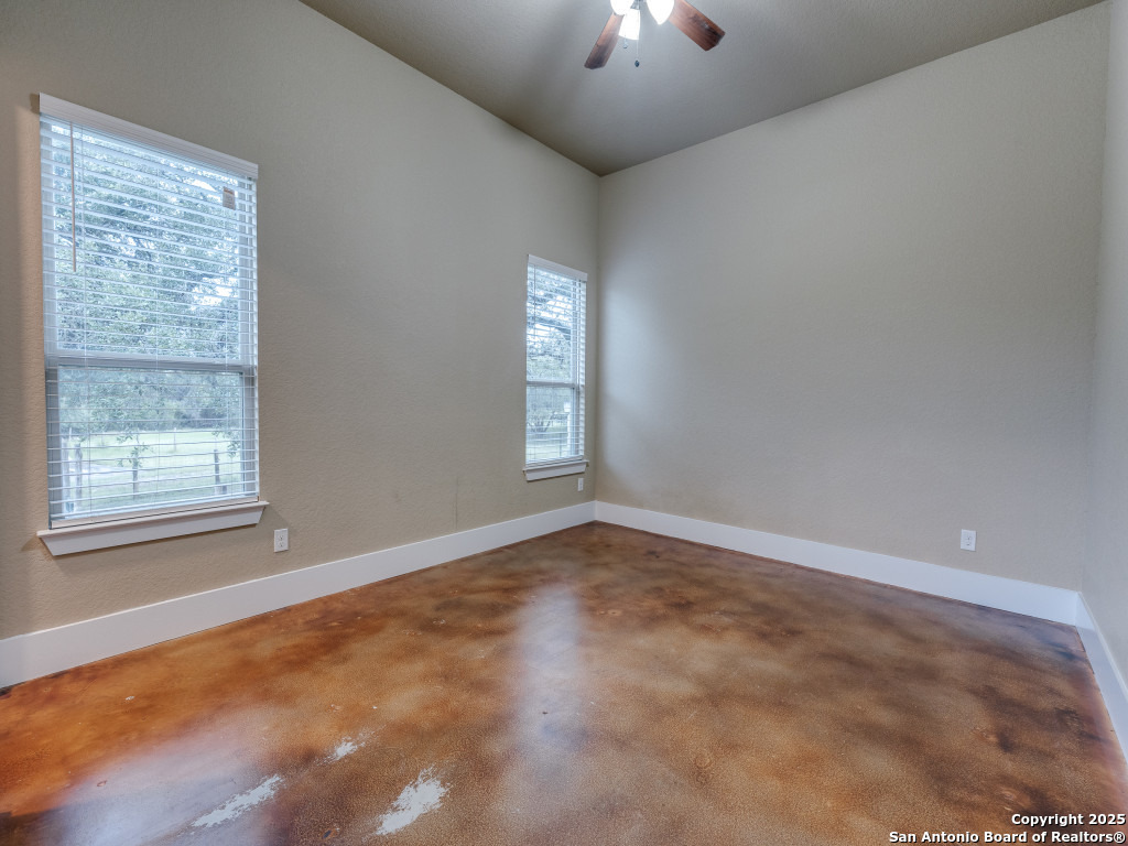 629 Windmill Ranch Road Spring Branch, TX 78070 - Photo 24 of 34 an empty room with a window